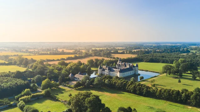 Aerial view of the château, its moat and the surrounding landscapes