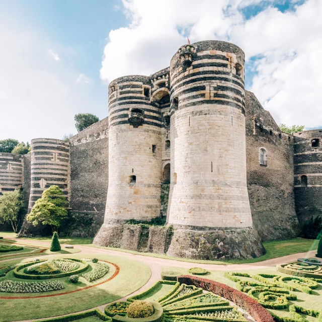 Wide shot of the Château and its gardens at the foot of the building