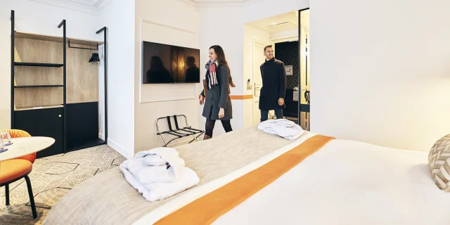 Couple entering their hotel room