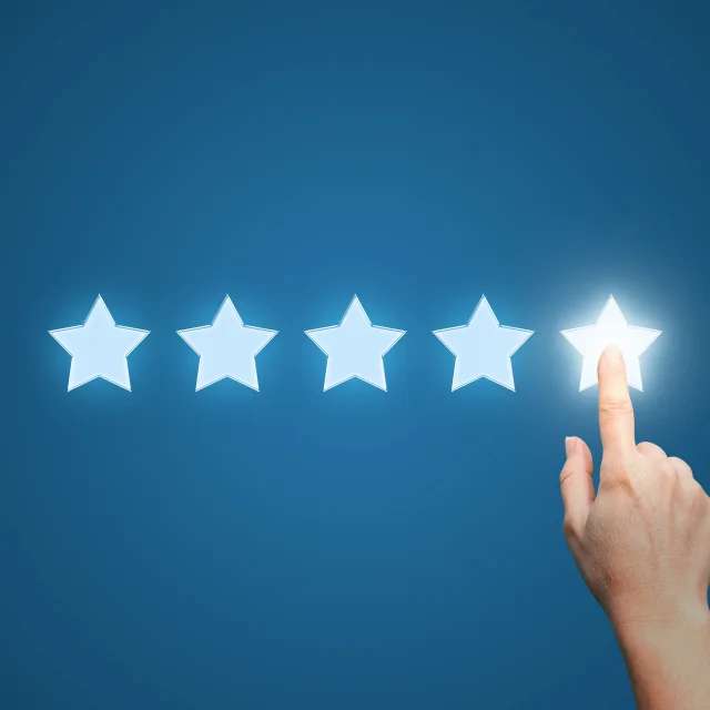 Businesswoman pointing five star to increase