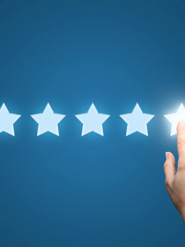 Businesswoman pointing five star to increase